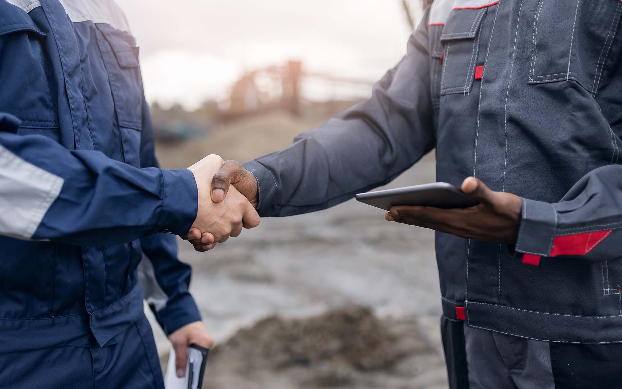 Collaborative Agreement, Multiracial Mining Engineers Shaking Hands In Quarry